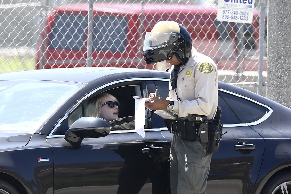 EMMA STONE Tries To Get Out of a Ticket